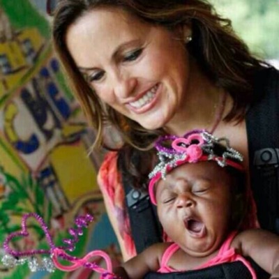 Mariska Hargitay holding the yawning baby Amaya Josephine Hermann.